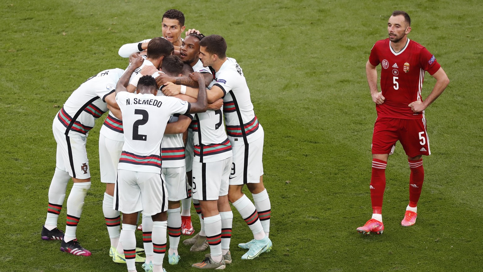 Portugal players celebrate their side&#039;s first goal during the Euro 2020 soccer championship group F match between Hungary and Portugal at the Ferenc Puskas stadium in Budapest, Hungary, Tuesday,  ...