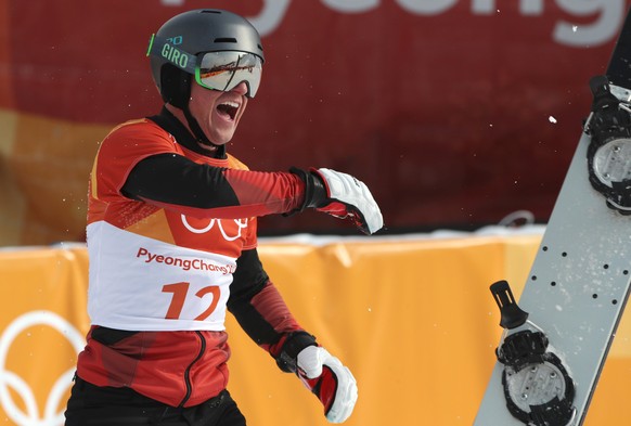 epa06559758 Nevin Galmarini of Switzerland throws his snowboard and yells as he jubilates his win jin the finals of the Men&#039;s Snowboard Parallel Giant Slalom competition at the Bokwang Phoenix Pa ...