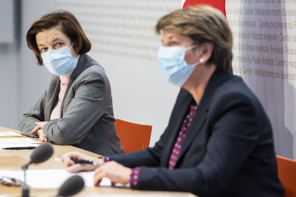 epa09090170 Swiss Federal Councilor Viola Amherd (R) and Florence Parly (L), Defense Minister of France, speak during a press conference in Bern, Switzerland, 22 March 2021. Florence Parly is on her o ...