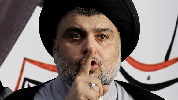 FILE - In this March, 27, 2016 file photo, Shiite cleric Muqtada al-Sadr gives a speech to his followers before entering the highly fortified Green Zone, in Baghdad, Iraq. Al-Sadr, who led punishing a ...