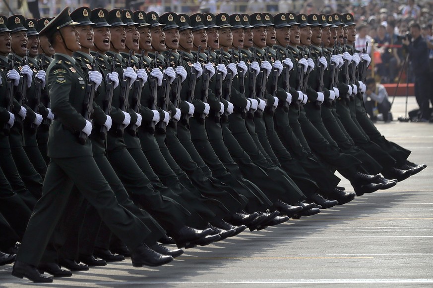Soldiers from China&#039;s People&#039;s Liberation Army (PLA) march in formation during a parade to commemorate the 70th anniversary of the founding of Communist China in Beijing, Tuesday, Oct. 1, 20 ...