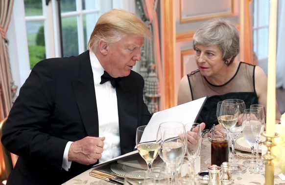 US President Donald Trump and Britain&#039;s Prime Minister Theresa May speak, during the Return Dinner in Winfield House, the residence of the Ambassador of the United States of America to the UK, in ...