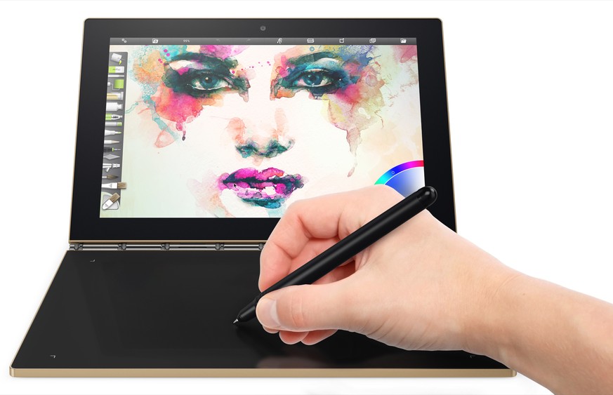 This image provided by Lenovo shows the company&#039;s Yoga Book, which doesn&#039;t have a physical keyboard. The Yoga Book retains the clamshell design of a laptop, but puts a second touch screen wh ...