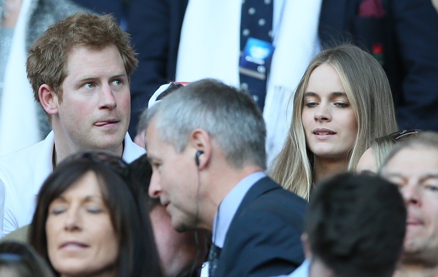 FILE - A Sunday, March 9, 2014 photo from files showing Britain&#039;s Prince Harry, top left, with his girlfriend Cressida Bonas, top right, as they attend the Six Nations Rugby Union match between E ...