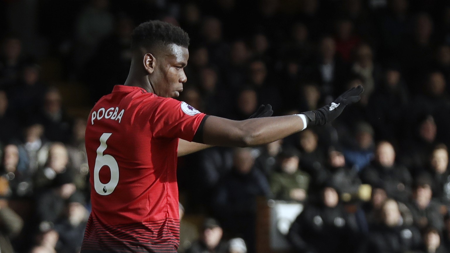 Manchester United&#039;s Paul Pogba celebrates after scoring his side&#039;s third goal from penalty during the English Premier League soccer match between Fulham and Manchester United at Craven Cotta ...