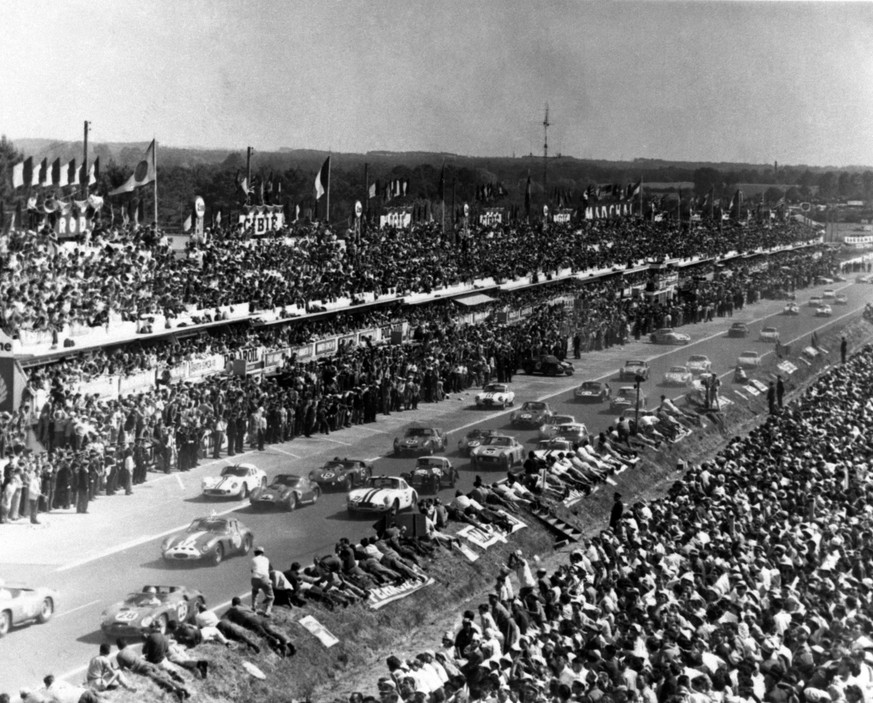 Fifty-five sleek race cars roar away in the classic start of the Le Mans 24 hour endurance race at Le Mans, France, June 24, 1962. Phil Hill of the United States and Olivier Gendebien of Belgium drove ...