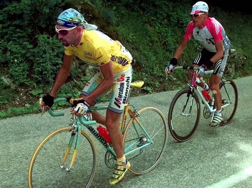 Former yellow jersey Jan Ullrich of Germany, right, trails new overall leader Marco Pantani of Italy during the 16th stage of the Tour de France cycling race between Vizille and Albertville in the Fre ...
