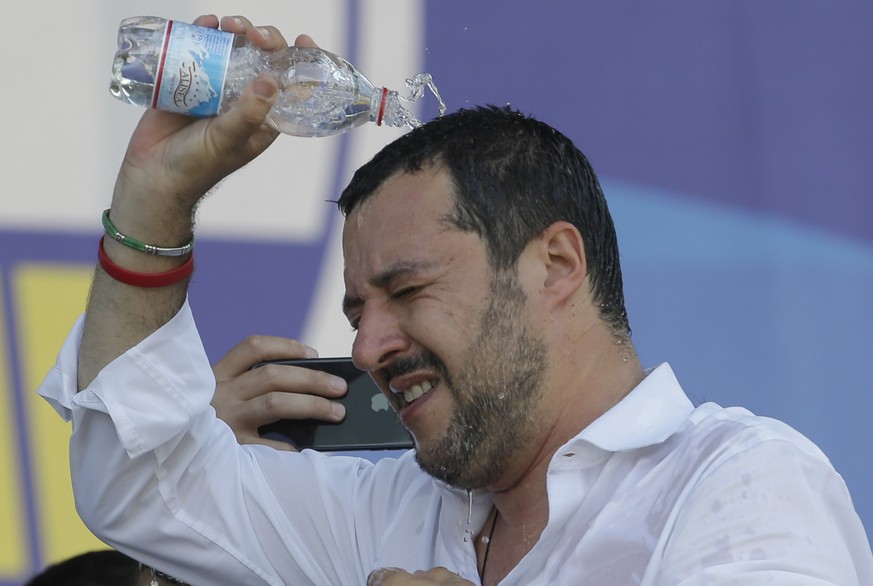 Matteo Salvini refreshes with some water during the traditional League party rally in Pontida, northern Italy, Sunday, July 1, 2018. Italian Interior Minister, and right-wing League Leader Matteo Salv ...