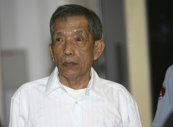FILE - In this March 30, 2020, file photo, former Khmer Rouge prison chief Kaing Guek Eav, also know as Duch, looks on during the first day of a U.N.-backed tribunal in Phnom Penh, Cambodia. The Khmer ...