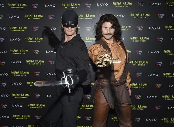 Actor Neil Patrick Harris, left, and husband David Burtka attend Heidi Klum&#039;s 19th annual Halloween party at Lavo New York on Wednesday, Oct. 31, 2018, in New York. (Photo by Evan Agostini/Invisi ...