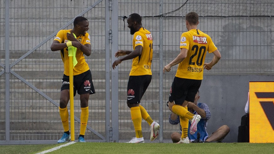 Young Boys&#039; midfielder Christopher Martins, left, celebrates his goal past teammates midfielder Nicolas Moumi Ngamaleu, center, and midfielder Michel Aebischer, right, after scoring the 0:1, duri ...