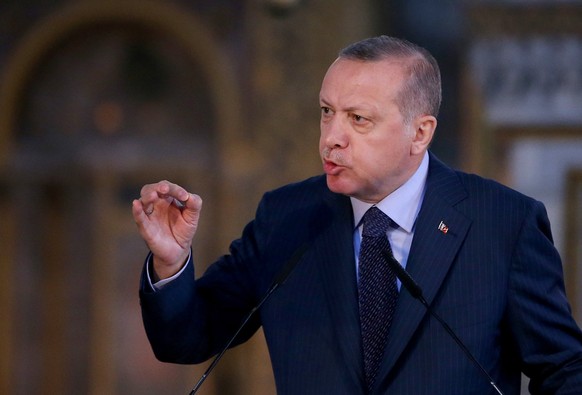 epa06638395 Turkish President Recep Tayyip Erdogan speaks during the opening ceremony of Yeditepe Biennial at The Hagia Sophia museum in Istanbul, Turkey, 31 March 2018. Yeditepe Biennial is the first ...