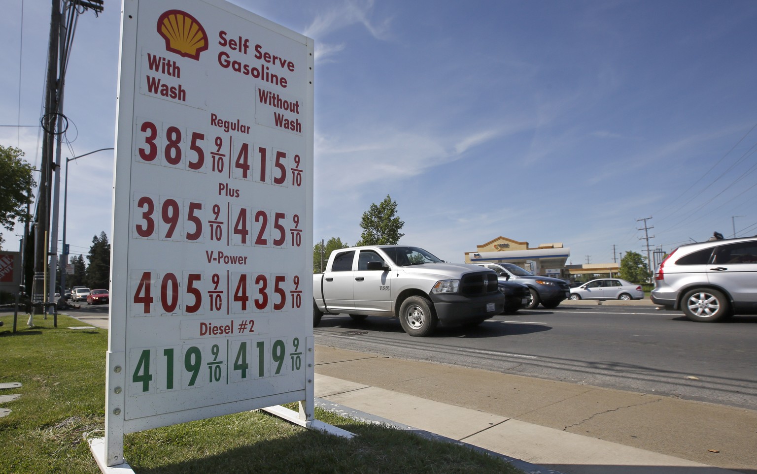 FILE - This April 23, 2019 file photo shows gas prices are displayed at a Shell station in Sacramento, Calif. Four major automakers have reached a secret deal with California to increase gas mileage a ...