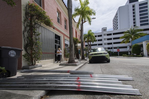 Bonnie Gruner boards up the building she manages at 303 Gardenia St. in downtown West Palm Beach on Saturday, Aug. 1, 2020. Gruner says, &quot;The building is from the 1920&#039;s, we are prepared wit ...