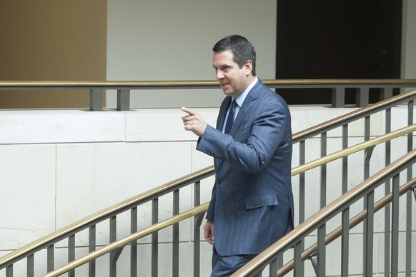 House Intelligence Committee Chairman Devin Nunes, R-Ca., points to reporters as he walks to a committee meeting on Russia where former White House strategist Steve Bannon is testifying, on Capitol Hi ...