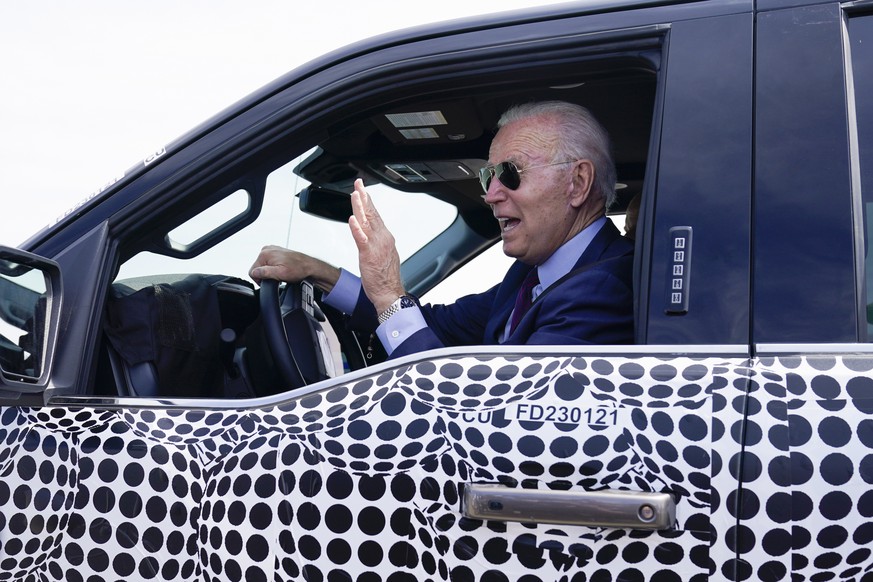 President Joe Biden stops to talk to the media as he drives a Ford F-150 Lightning truck at Ford Dearborn Development Center, Tuesday, May 18, 2021, in Dearborn, Mich. (AP Photo/Evan Vucci)
Joe Biden