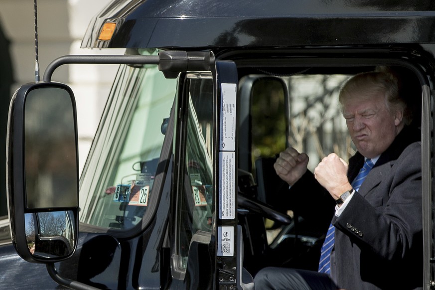DAY 63 - in this March 23, 2017, file photo, President Donald Trump gestures while sitting in an 18-wheeler truck while meeting with truckers and CEOs regarding healthcare on the South Lawn of the Whi ...