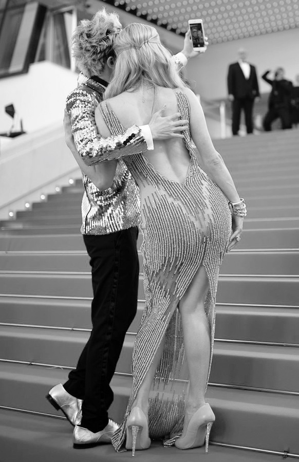 epa04755693 US socialite Paris Hilton (R) and Chinese actor Sun Zu Yang (L) make a selfie as they arrive for the screening of &#039;Inside Out&#039; during the 68th annual Cannes Film Festival, in Can ...