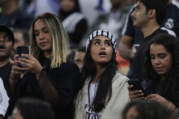 Fans attend the Spanish Super Cup semifinal soccer match between Real Madrid and Valencia at King Abdullah stadium in Jiddah, Saudi Arabia, Wednesday, Jan. 8, 2020. (AP Photo/Amr Nabil)