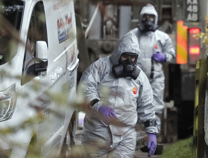 Military forces work on a van in Winterslow, England, Monday, March 12, 2018, as investigations continue into the nerve-agent poisoning of Russian ex-spy Sergei Skripal and his daughter Yulia, in Sali ...
