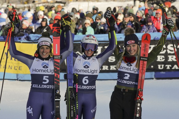 Italy&#039;s Marta Bassino, center, winner of an alpine ski, women&#039;s World Cup giant slalom, poses with second placed Italy&#039;s Federica Brignone, left, and third placed United States&#039; Mi ...