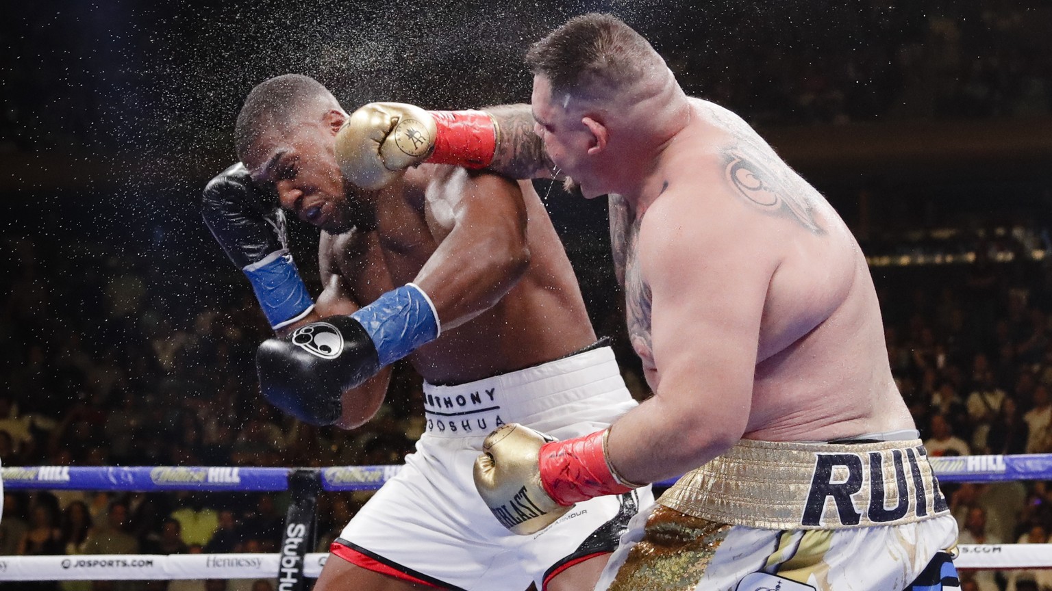 Andy Ruiz, right, punches Anthony Joshua during the seventh round of a heavyweight championship boxing match Saturday, June 1, 2019, in New York. Ruiz won in the seventh round. (AP Photo/Frank Frankli ...