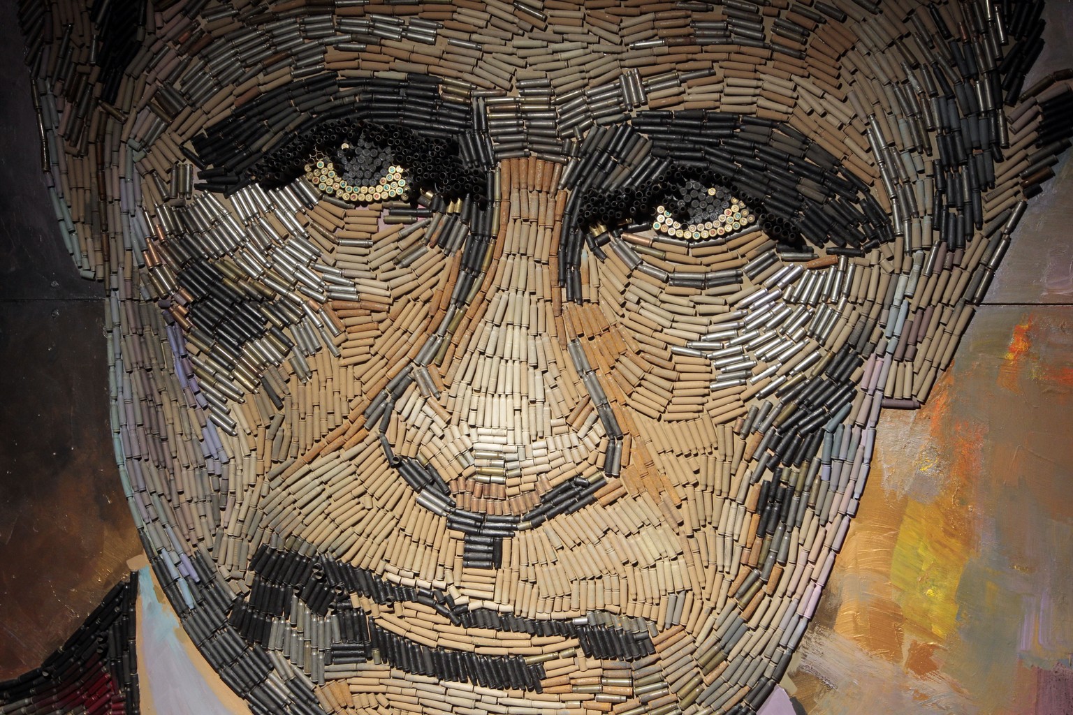 In this photo taken on Wednesday, July 22, 2015, a portrait of Russian President Vladimir Putin, made by Ukrainian artist Dasha Marchenko out of cartridge cases, is seen in the artist&#039;s studio in ...