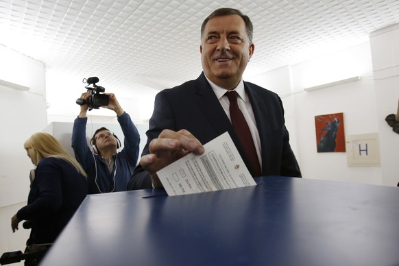 Bosnian Serb leader Milorad Dodik casts his ballot at a poling station during referendum in the Bosnian town of Laktasi, northwest of the Bosnian capital of Sarajevo, Bosnia, Sunday, Sept. 25, 2016. B ...