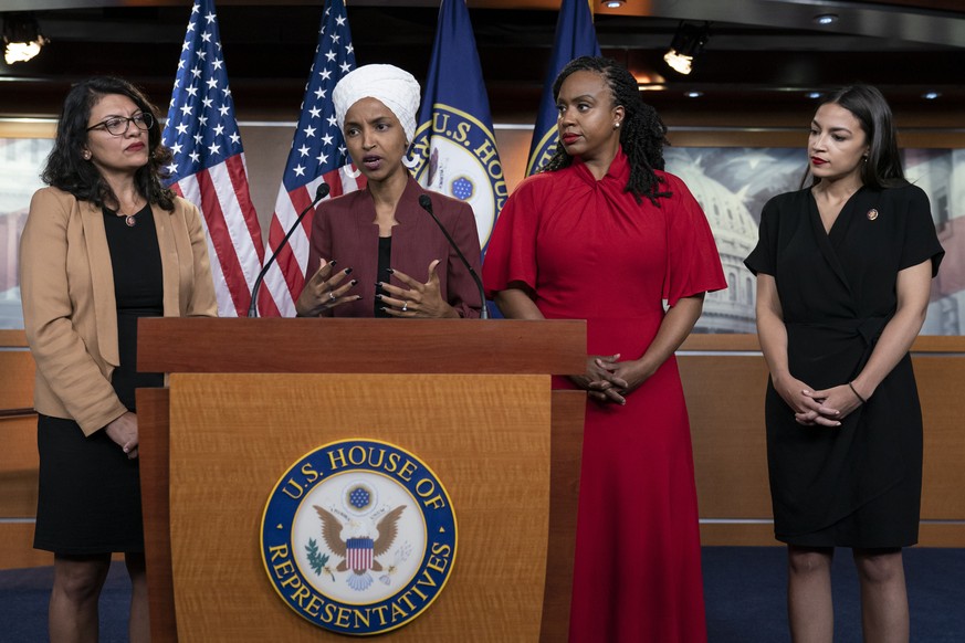 FILE - In this Monday, July 15, 2019, file photo, U.S. Rep. Ilhan Omar, D-Minn, second from left, speaks, as U.S. Reps., from left, Rashida Tlaib, D-Mich.,Ayanna Pressley, D-Mass., and Alexandria Ocas ...