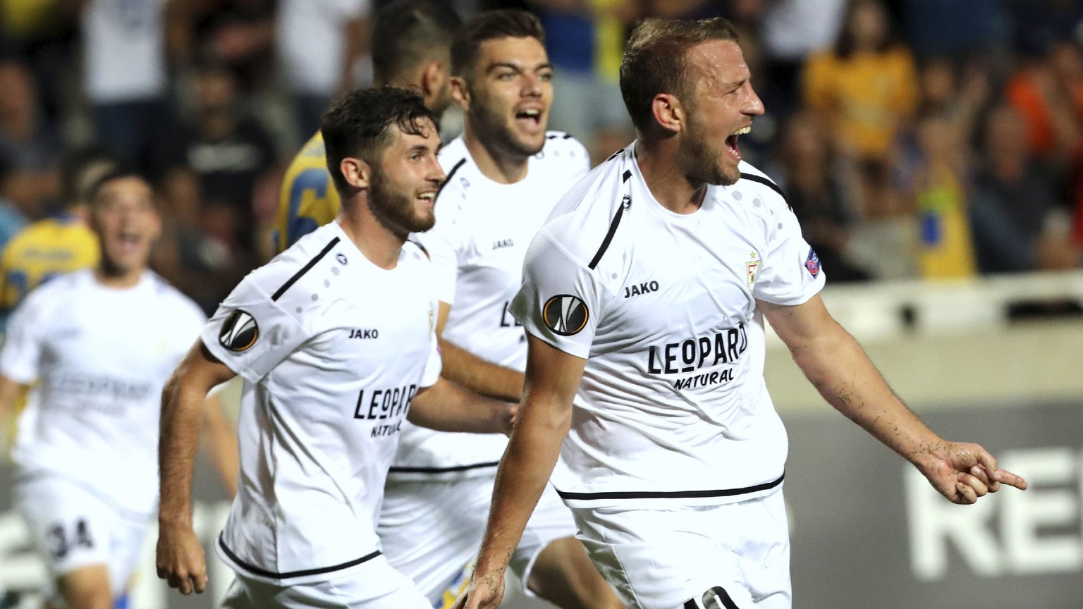 Dudelange&#039;s Dominik Stolz, right, celebrates with his teammates his goal against APOEL during the Europa League group A soccer match between APOEL Nicosia and Dudelange at GSP stadium in Nicosia, ...