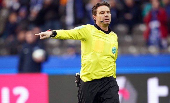 epa08276807 Referee Guido Winkmann awards a penalty during the German Bundesliga soccer match between Hertha BSC and Werder Bremen in Berlin, Germany, 07 March 2020. EPA/CLEMENS BILAN CONDITIONS - ATT ...