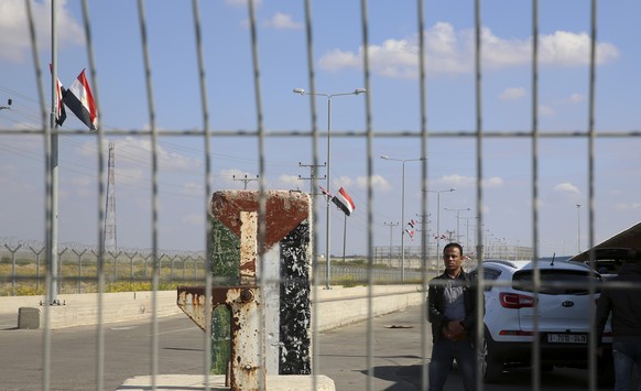 An employee of the Palestinian Authority stands guard on the Palestinian side of the Erez checkpoint between Israel and Gaza, at Beit Hanoun, Gaza Strip, Wednesday, Nov. 1, 2017. The Islamic militant  ...
