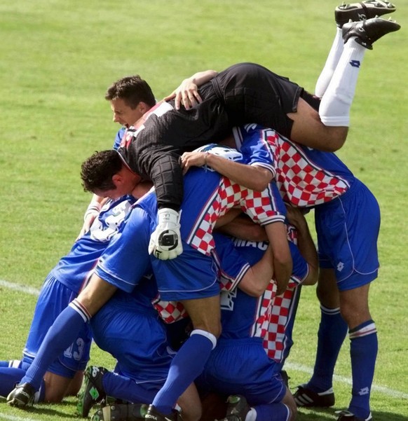 Croatia&#039;s goalkeeper Drazen Ladic jumps over his team mates as they celebrate after the Romania-Croatia second round World Cup 98, soccermatch at Parc Lescure stadium in BordeauxTuesday, June 30  ...