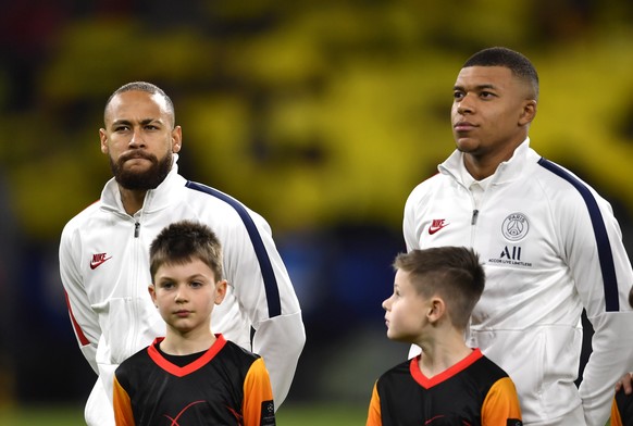 PSG&#039;s Neymar, left, and PSG&#039;s Kylian Mbappe prior the Champions League round of 16 first leg soccer match between Borussia Dortmund and Paris Saint Germain in Dortmund, Germany, Tuesday, Feb ...