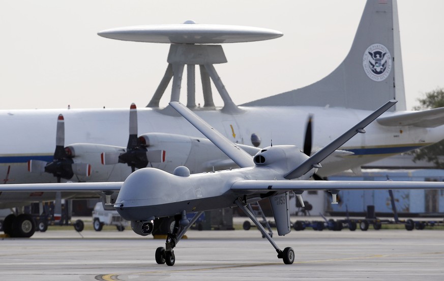 FILE - In this Nov. 8, 2011 file photo, a Predator B unmanned aircraft taxis at the Naval Air Station in Corpus Christi, Texas. A U.S. military drone strike in Yemen in December 2013 may have killed u ...