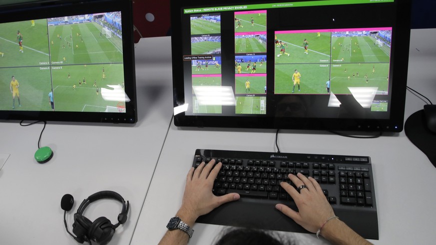 A referee demonstrates a video operation room (VOR), a facility of the Video Assistant Referee (VAR) system which will be rolled out for the first time during the World Cup, at the 2018 World Cup Inte ...