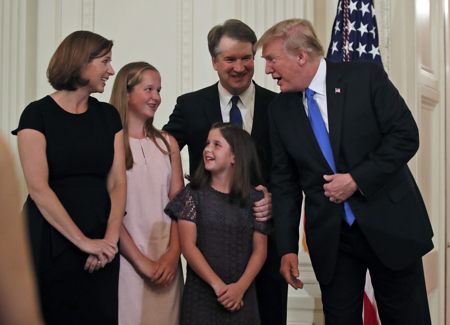 President Donald Trump talks with Judge Brett Kavanaugh his Supreme Court nominee, and his family in the East Room of the White House, Monday, July 9, 2018, in Washington. (AP Photo/Alex Brandon)