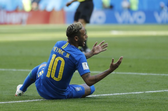 Brazil&#039;s Neymar reacts after falling in the penalty area during the group E match between Brazil and Costa Rica at the 2018 soccer World Cup in the St. Petersburg Stadium in St. Petersburg, Russi ...