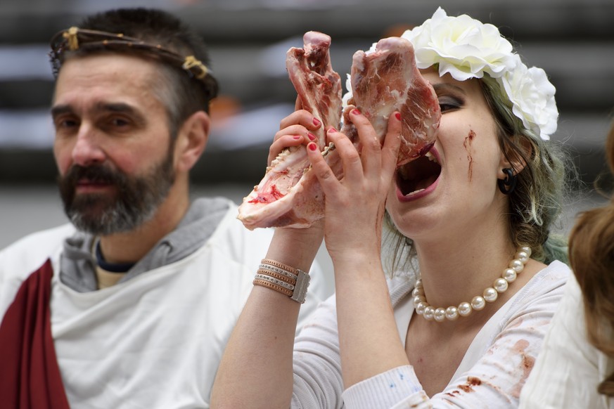 Animal rights activists re-enact the Holy Last Supper during the happening &quot;The Bloody Meal of the Resurrection&quot; at a demonstration by the animal liberation movement &#039;269life&#039;, in  ...
