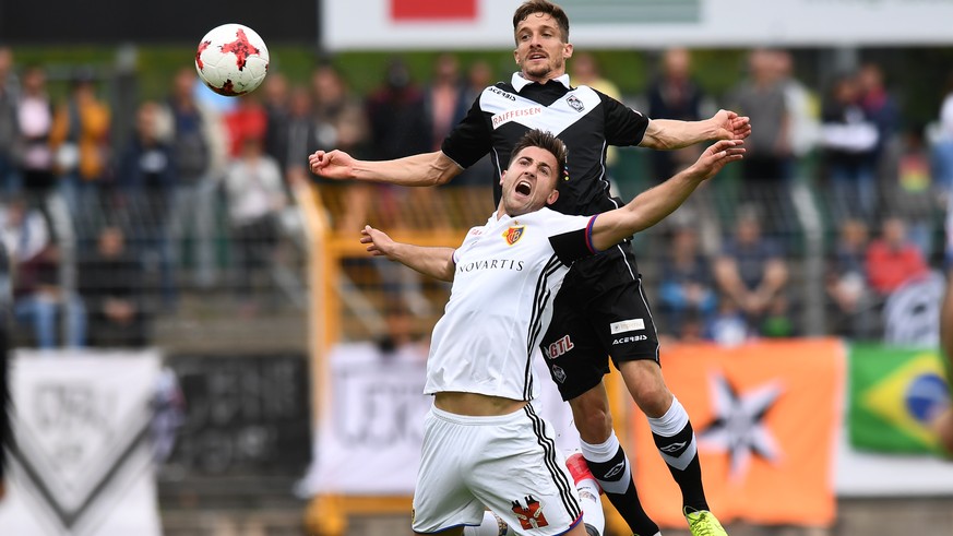 Lugano&#039;s player Fulvio Sulmoni, right, fights for the ball with Basel&#039;s player Andraz Sporar, left, during the Super League soccer match FC Lugano against FC Basel, at the Cornaredo stadium  ...