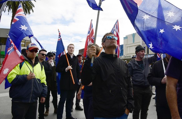 epa07665178 Members of the True Blue Crew attend the Aussie Flag Solidarity March in Penrith, Sydney, Australia, 22 June 2019. The extreme right wing group was supported by alleged Christchurch terror ...