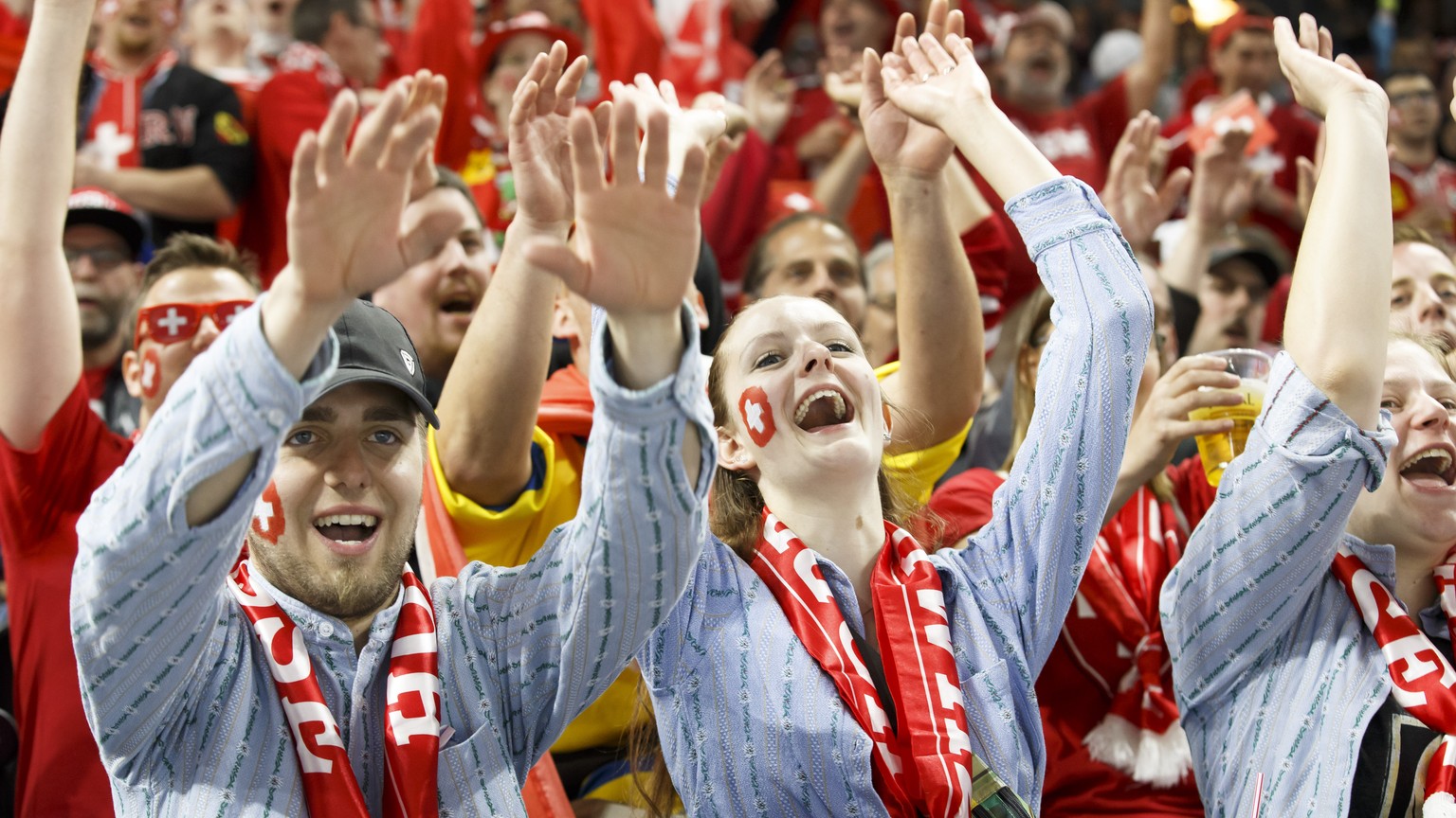 Switzerland&#039;s supporters cheer their team, during the IIHF 2018 World Championship preliminary round game between Slovakia and Switzerland, at the Royal Arena, in Copenhagen, Denmark, Sunday, May ...