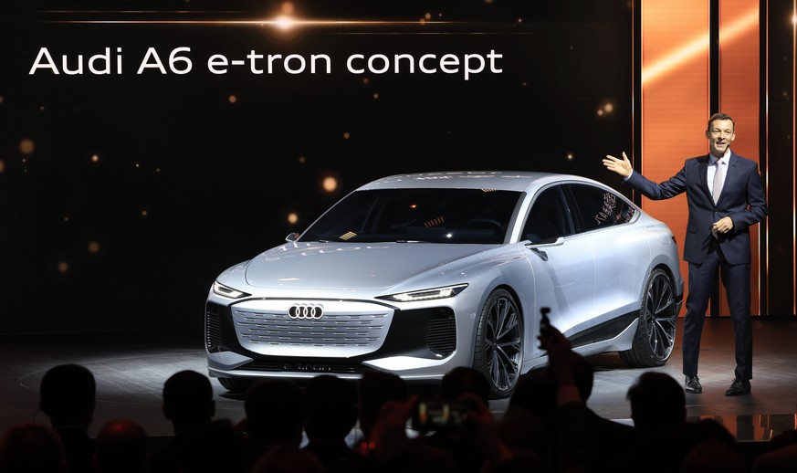 Werner Eichhorn, President Audi China unveils the Audi e-tron concept car during the Shanghai Auto Show in Shanghai on Monday, April 19, 2021. Automakers are looking to China, their biggest market by  ...