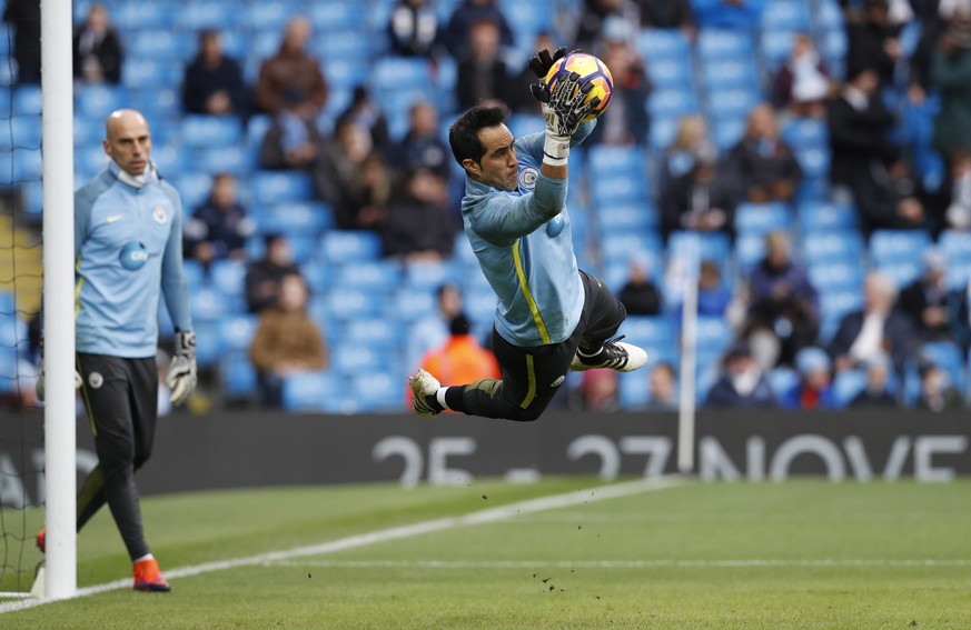 Britain Football Soccer - Manchester City v Middlesbrough - Premier League - Etihad Stadium - 5/11/16 Manchester City&#039;s Claudio Bravo warms up before the match as Manchester City&#039;s Willy Cab ...