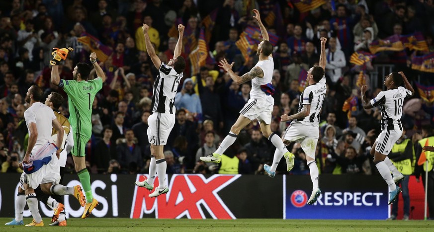Juventus players celebrate at the end of the Champions League quarterfinal second leg soccer match between Barcelona and Juventus at Camp Nou stadium in Barcelona, Spain, Wednesday, April 19, 2017. Th ...