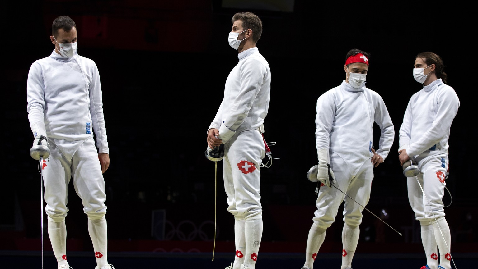 epa09378824 (L-R) - Lucas Malcotti, Benjamin Steffen, Max Heinzer and Michele Niggeler of Switzerland, from left, prior to the men&#039;s epee team classifications 5-8 match between Switzerland and Fr ...