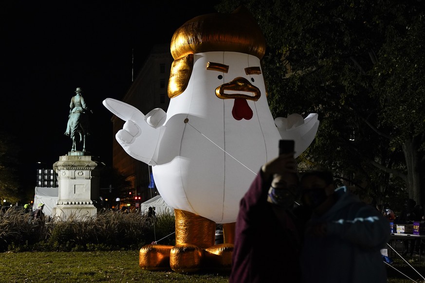 An inflatable chicken made to look like Pres. Donald Trump is displayed at McPherson Square, Tuesday, Nov. 3, 2020, in Washington. (AP Photo/Jacquelyn Martin)