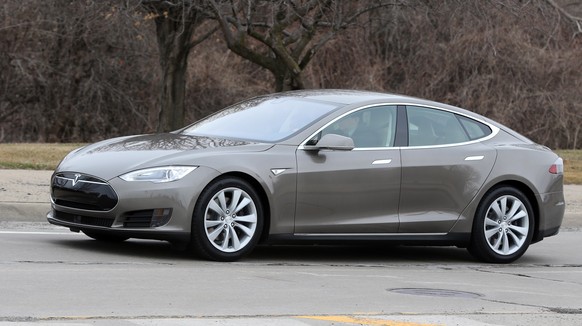 In a photo from Tuesday, April 7, 2015 in Detroit, a Tesla Model S 70D is seen during a test drive. Electric car maker Tesla Motors is seeking mainstream luxury buyers by adding all-wheel-drive and mo ...