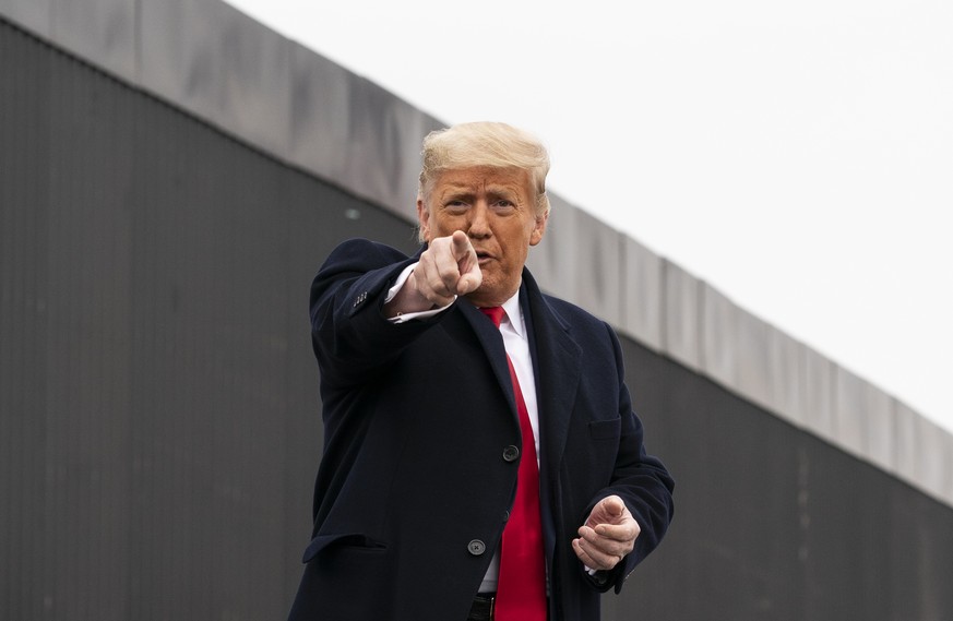 President Donald Trump points to a member of the audience after speaking near a section of the U.S.-Mexico border wall, Tuesday, Jan. 12, 2021, in Alamo, Texas. (AP Photo/Alex Brandon)
Donald Trump