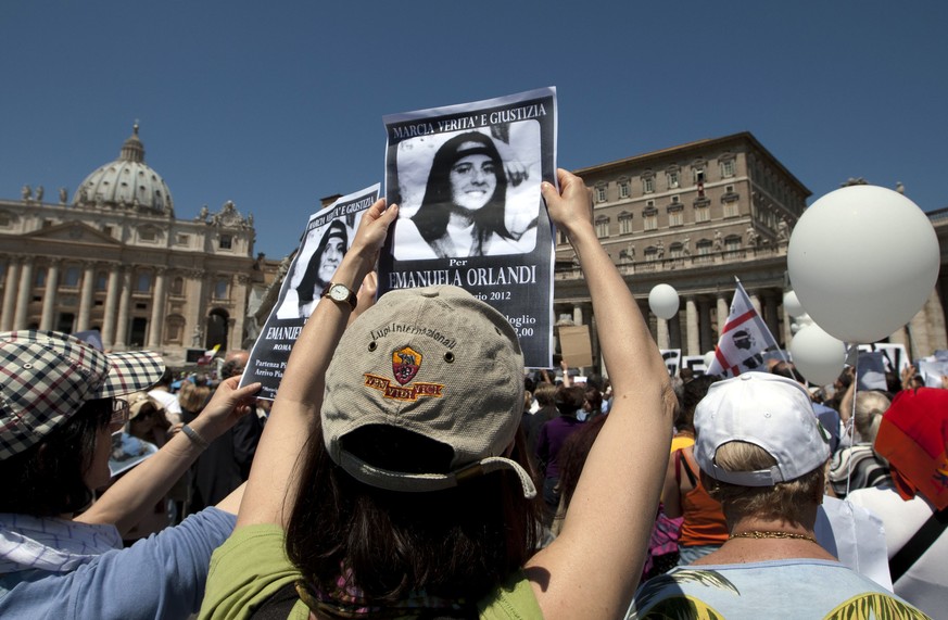 FILE - In this May 27, 2012, file photo, demonstrators hold pictures of Emanuela Orlandi reading &quot;march for truth and justice for Emanuela&quot; during Pope Benedict XVI&#039;s Regina Coeli praye ...